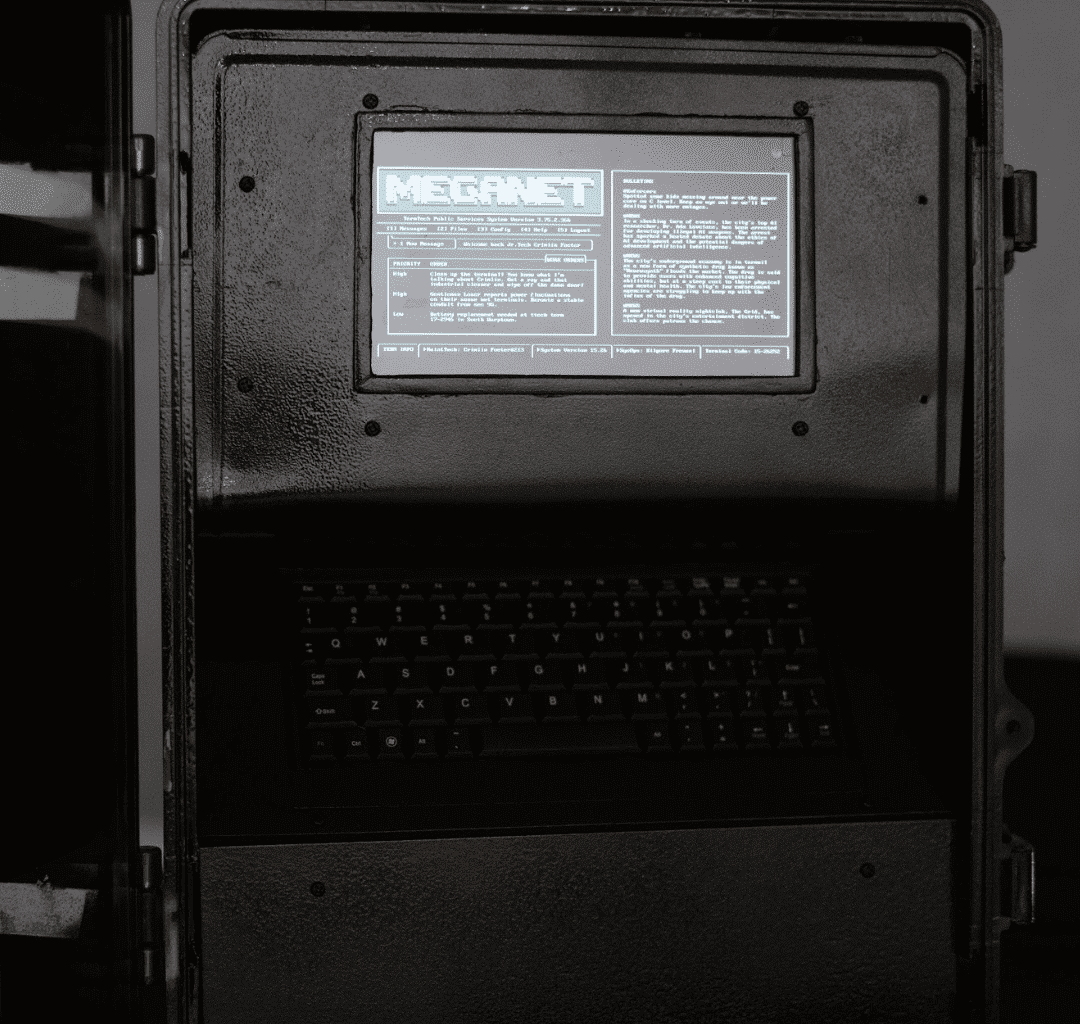 A close up image of a metal black box with a small, text filled screen
